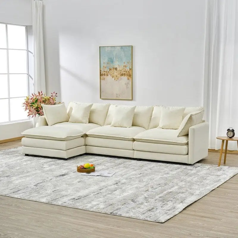 110.2 Canapé trois places capitonné en chenille, pouf