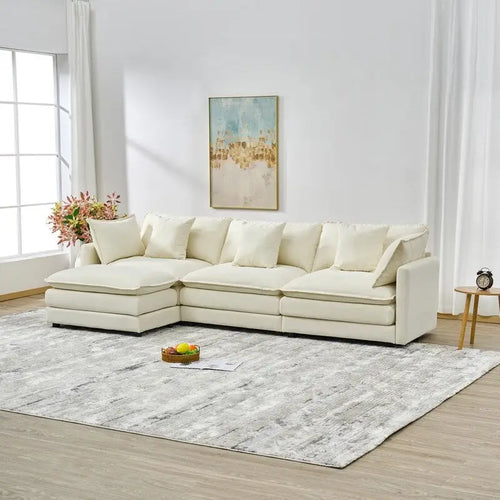 110.2 Canapé trois places capitonné en chenille, pouf