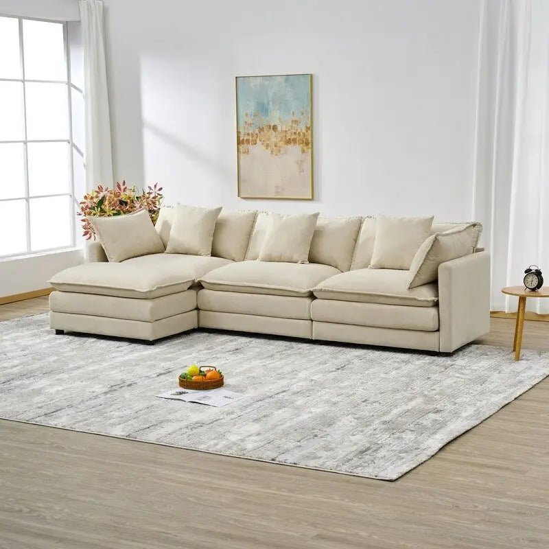 110.2 Canapé trois places capitonné en chenille, pouf