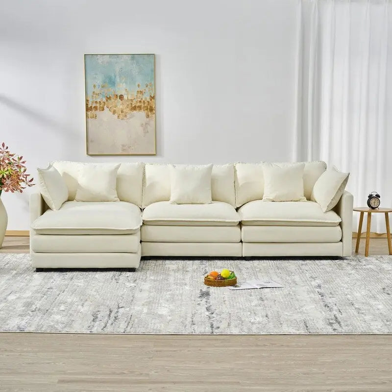 110.2 Canapé trois places capitonné en chenille, pouf