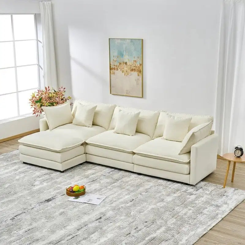 110.2 Canapé trois places capitonné en chenille, pouf