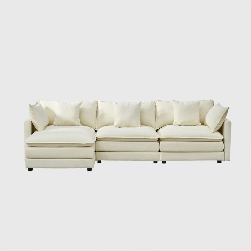 110.2 Canapé trois places capitonné en chenille, pouf