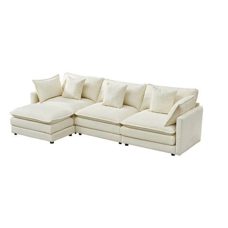 110.2 Canapé trois places capitonné en chenille, pouf