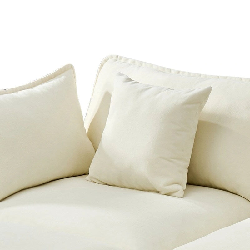 110.2 Canapé trois places capitonné en chenille, pouf