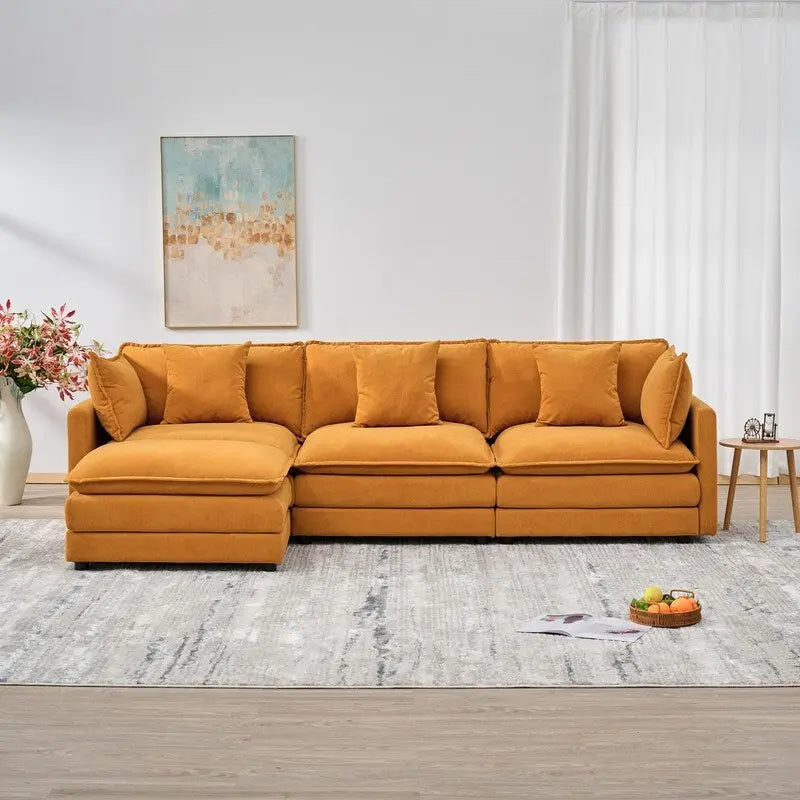 110.2 Canapé trois places capitonné en chenille, pouf