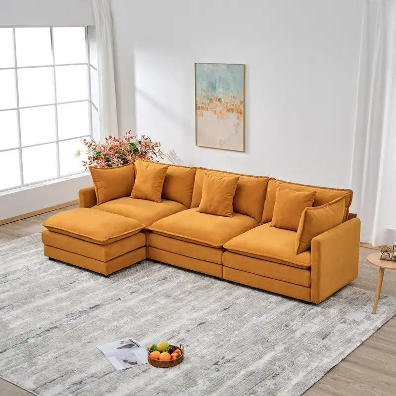 110.2 Canapé trois places capitonné en chenille, pouf