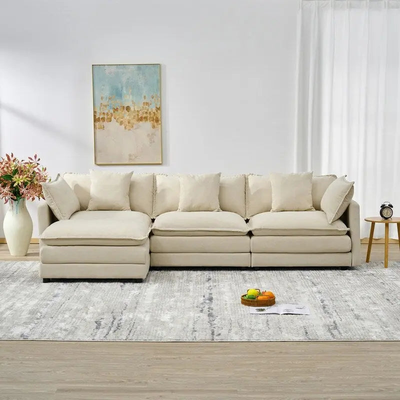 110.2 Canapé trois places capitonné en chenille, pouf