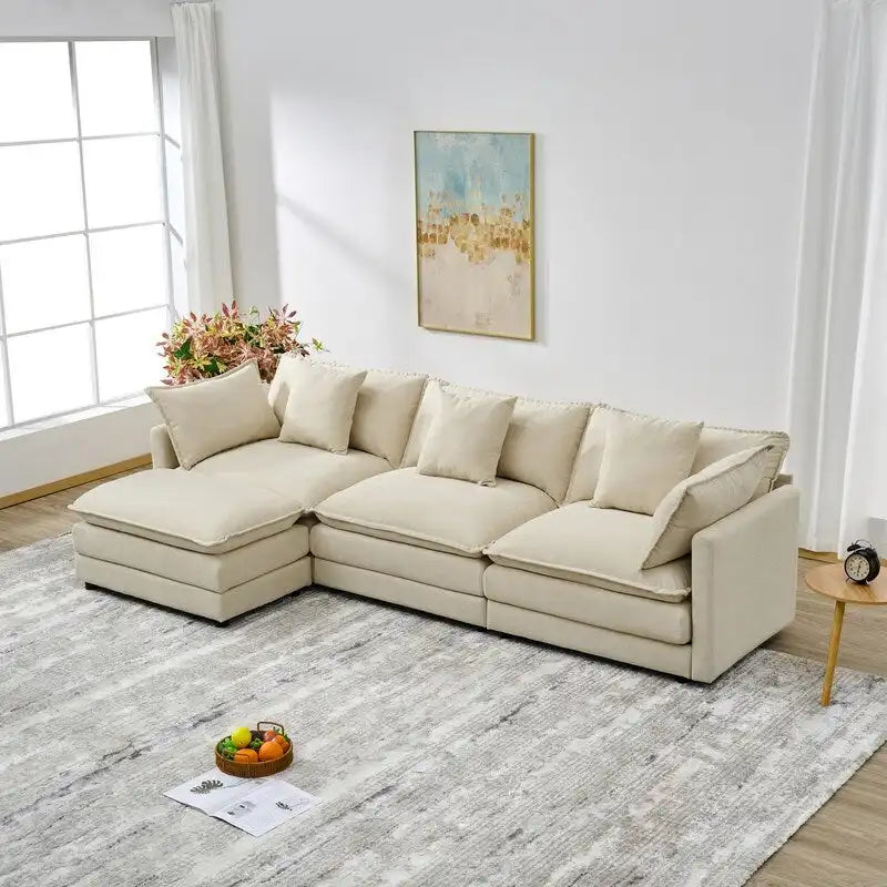 110.2 Canapé trois places capitonné en chenille, pouf