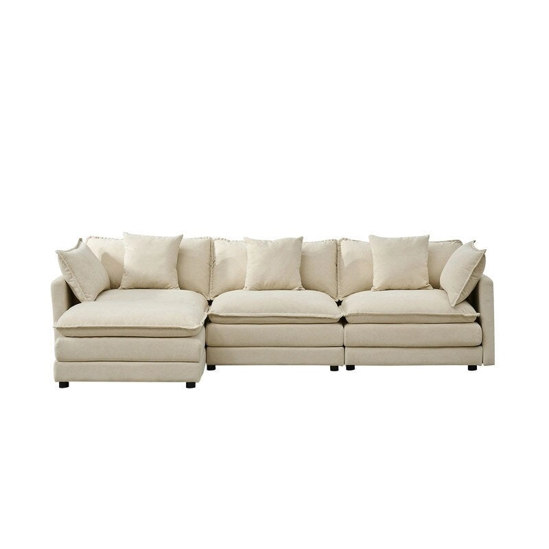 110.2 Canapé trois places capitonné en chenille, pouf