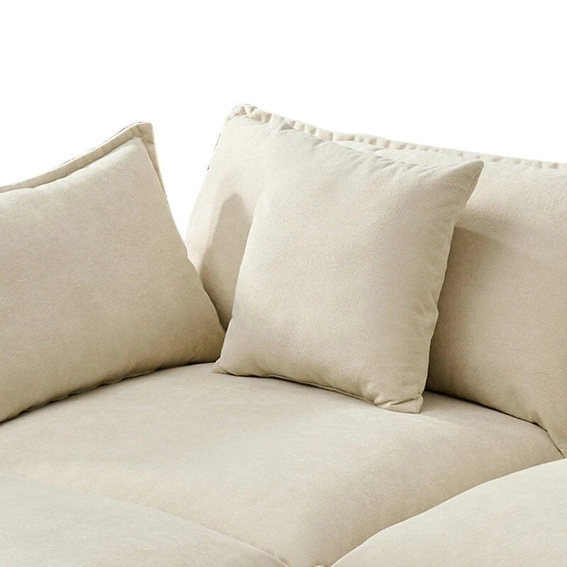 110.2 Canapé trois places capitonné en chenille, pouf
