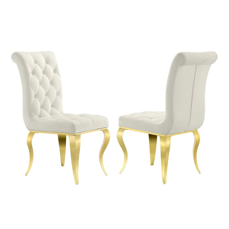 Chaises tapissées de velours avec dossier capitonné orné de cristaux et pieds cabriolets en métal miroir.